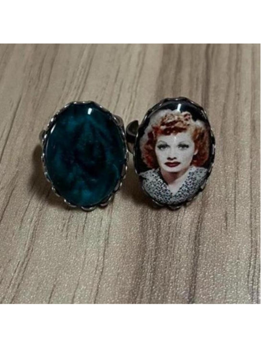 Set of 2 novelty rings — one with a Lucy Ricardo portrait and one with a blue ge
